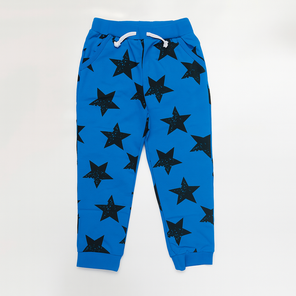 
                  
                    Blue boys’ jogger pants with black star pattern, white drawstring, elastic cuffs, and side pockets
                  
                